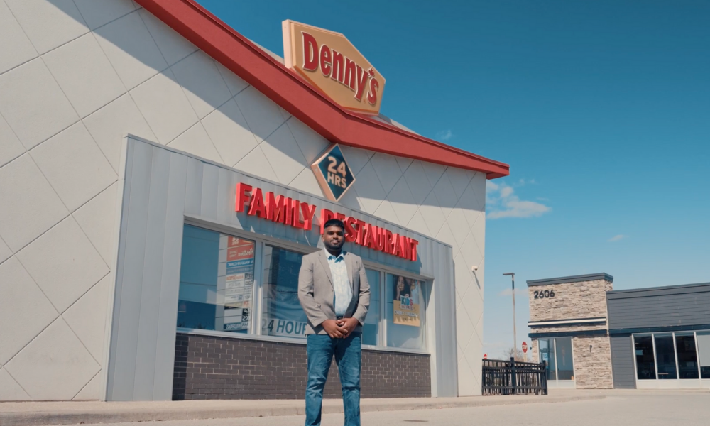 Avi Soma, Denny's franchisee, standing outside of Denny's location.